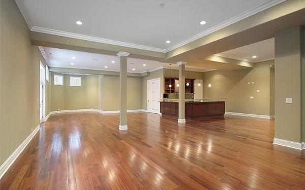 hardwood flooring can be installed over existing tile or carpet with the proper preparation